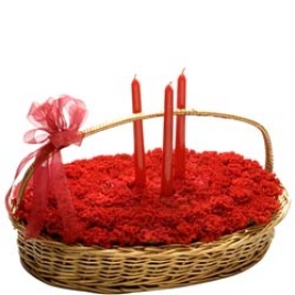 Bed Of Red Carnations With Colored Candles: India Florist Online